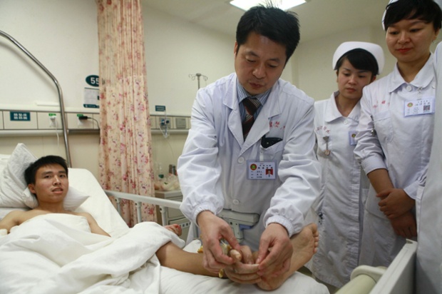 Man has severed hand attached to leg to keep it alive, Changsha, Hunan Province, China - 10 Dec 2013