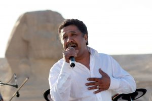 2008-03-14 17:38:34 epa01285501 World reknown Algerian rai singer Cheb Khaled preforms in front of the Sphinx with the  French Rap group IAM 14 March 2008. The group grave a free concert that was broadcast live in France and was also filmed for a documentary film they plan to screen at the Cannes Film Festival in May.  EPA/MIKE NELSON