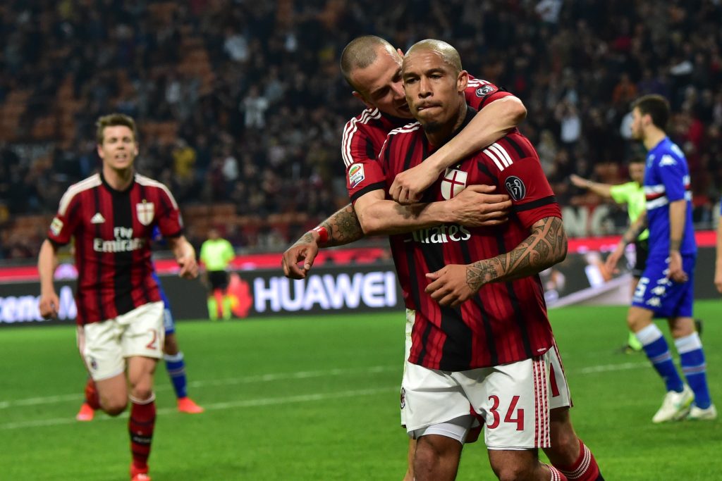 2015-04-12 22:16:52 AC Milan's midfielder from Netherlands Nigel de Jong (front) celebrates with AC Milan's defender Luca Antonelli after scoring during the Italian Serie A football match between AC Milan and Sampdoria at San Siro Stadium in Milan on April 12, 2015. AFP PHOTO / GIUSEPPE CACACE