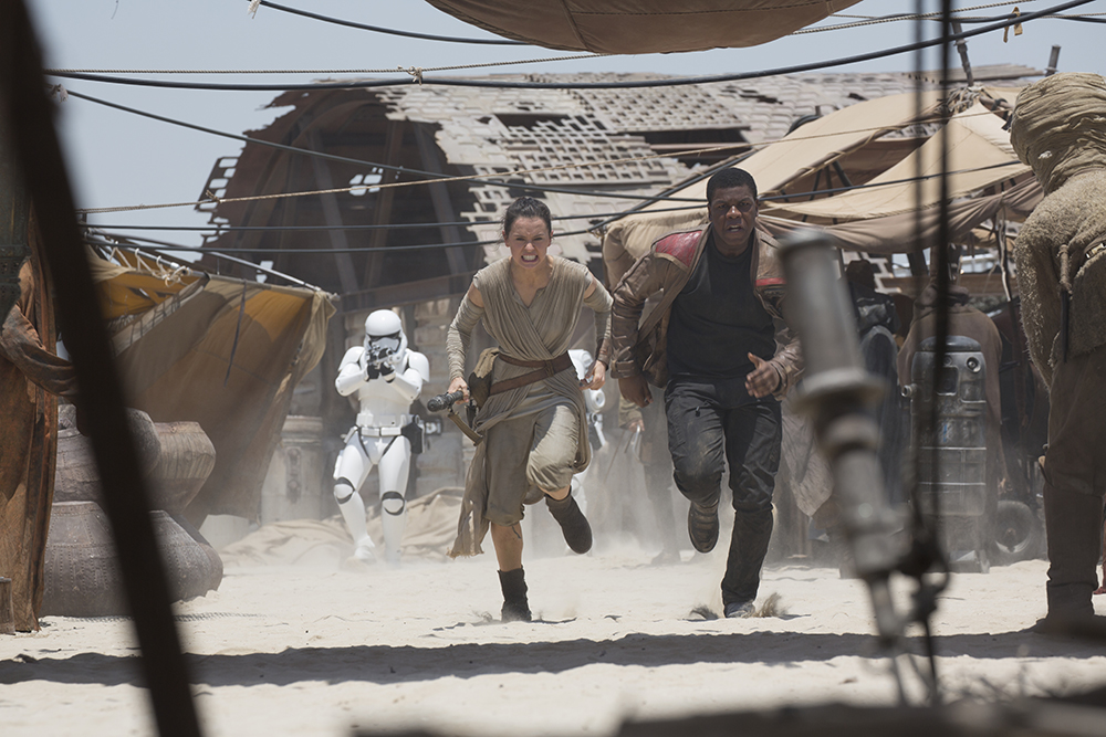 Star Wars: The Force Awakens..L to R: Rey (Daisy Ridley) and Finn (John Boyega)..Ph: David James..?Lucasfilm 2015