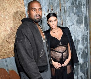Kanye West en de zwangere Kim Kardashian tijdens de New York Fashion Week in september.